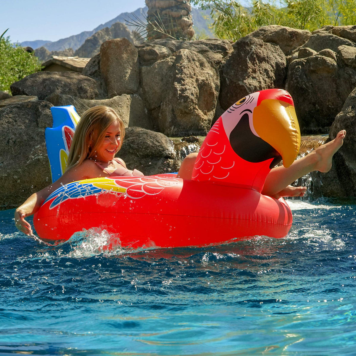 GoFloats Tropical Parrot pool float party setup for memorable photos.