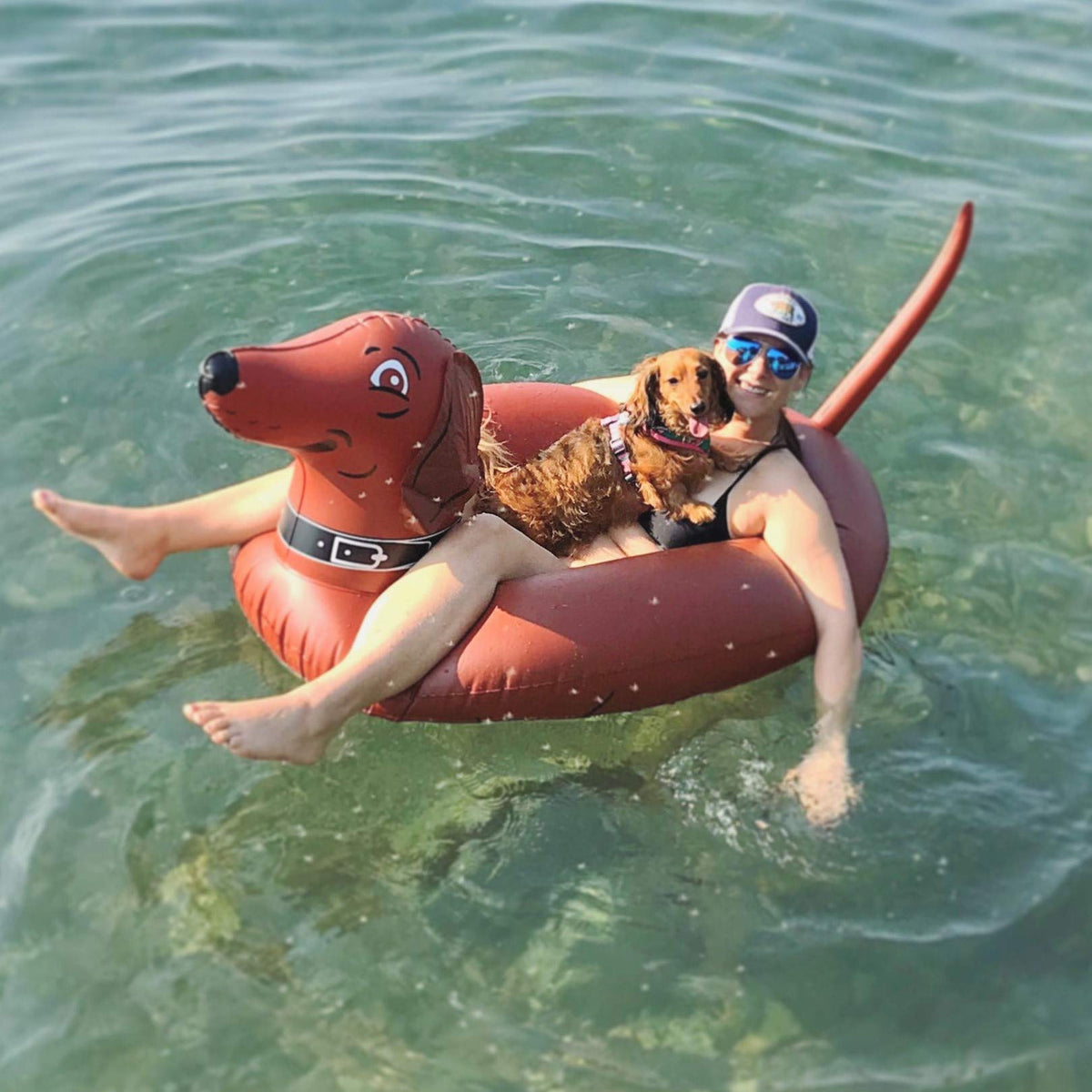GoFloats Wiener Dog Party Tube in pool enables family fun and stable lounging