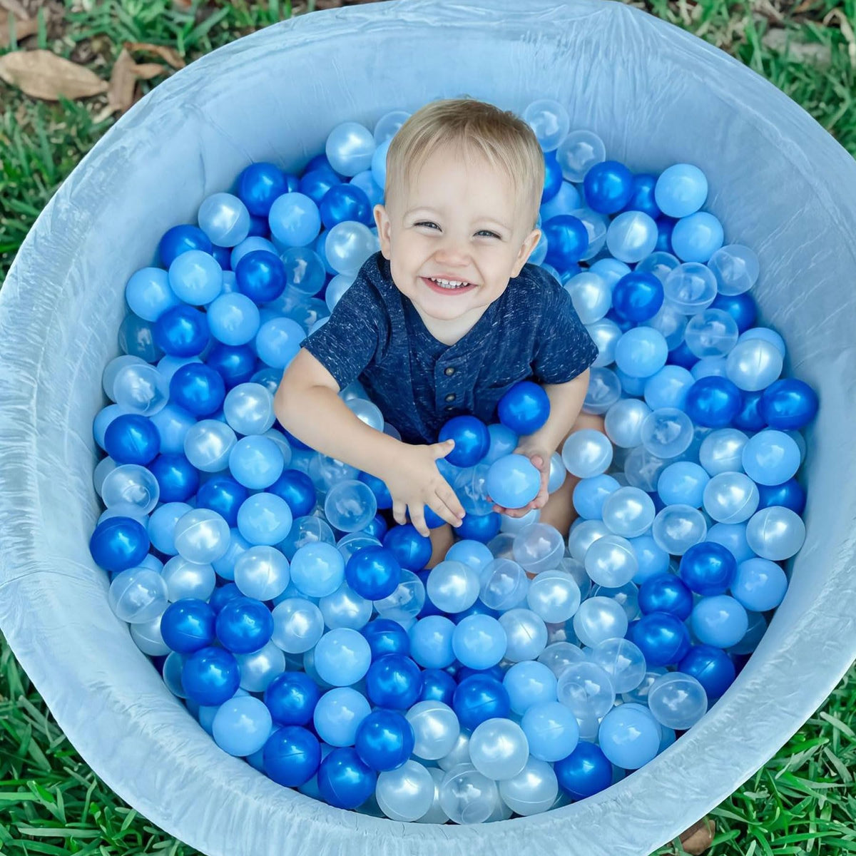 GOGOSO ball pit balls in use with a toddler, engaging color-filled play.