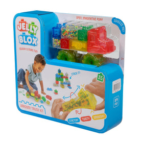 Goliath Jelly Blox Vrroom! Child enjoying squishy blocks promotes calm focus.
