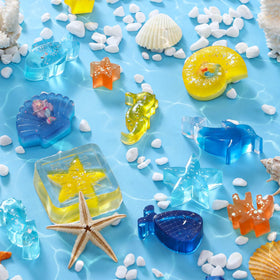 Golray molds feature mermaid tails and seashells for aquatic-themed soap art.