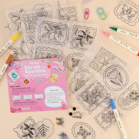 Grabie Bloom Post dual-tip markers add bold color to shrink art.