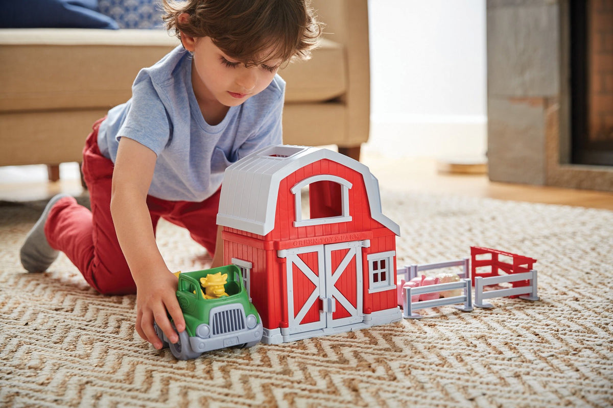 Green Toys Farm Playset pickup truck — supports fine motor skills and role-play scenarios.