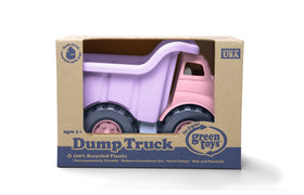 Green Toys pink dump truck lifting sand and rocks, safe for little hands.