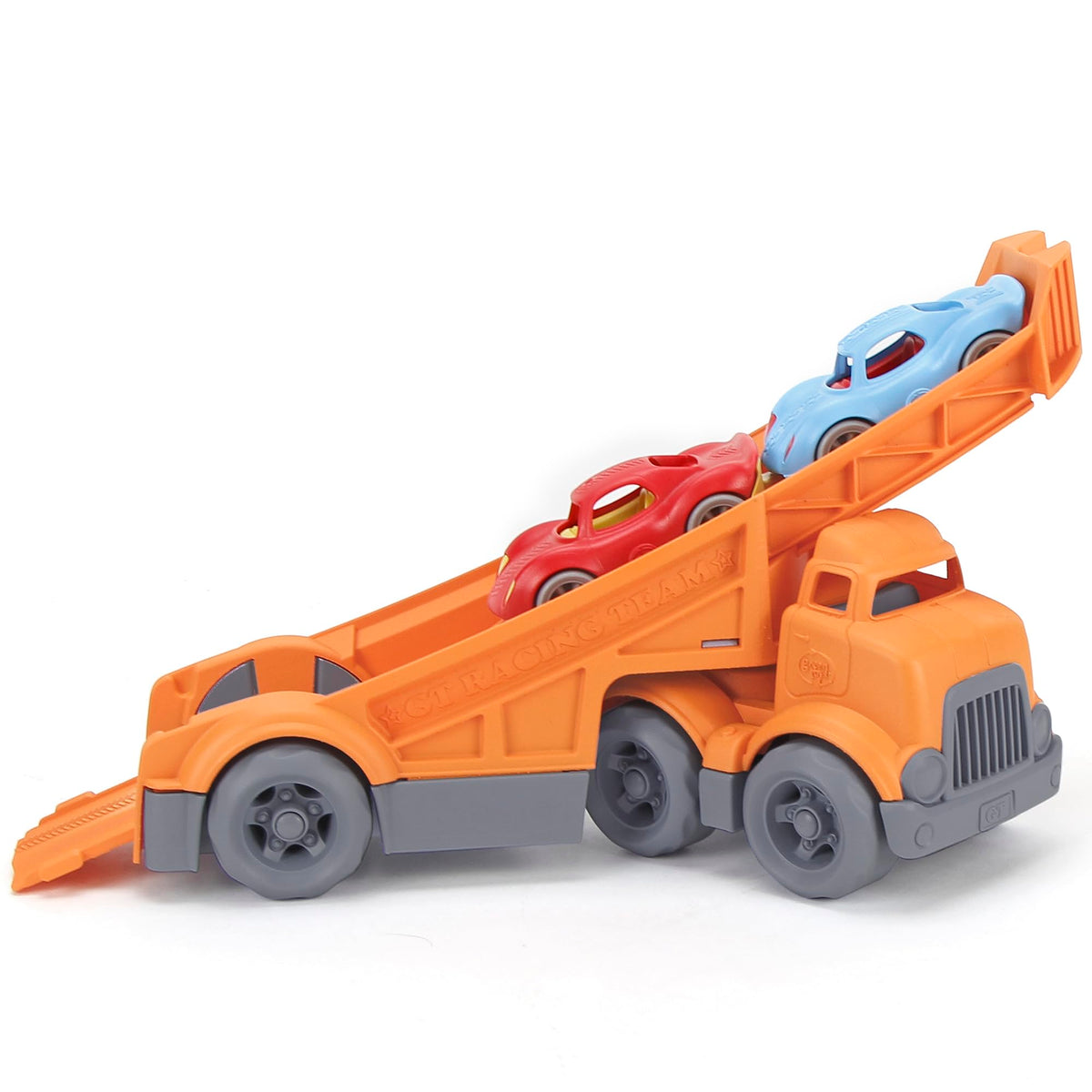 Green Toys racing truck on a play mat encouraging storytelling.