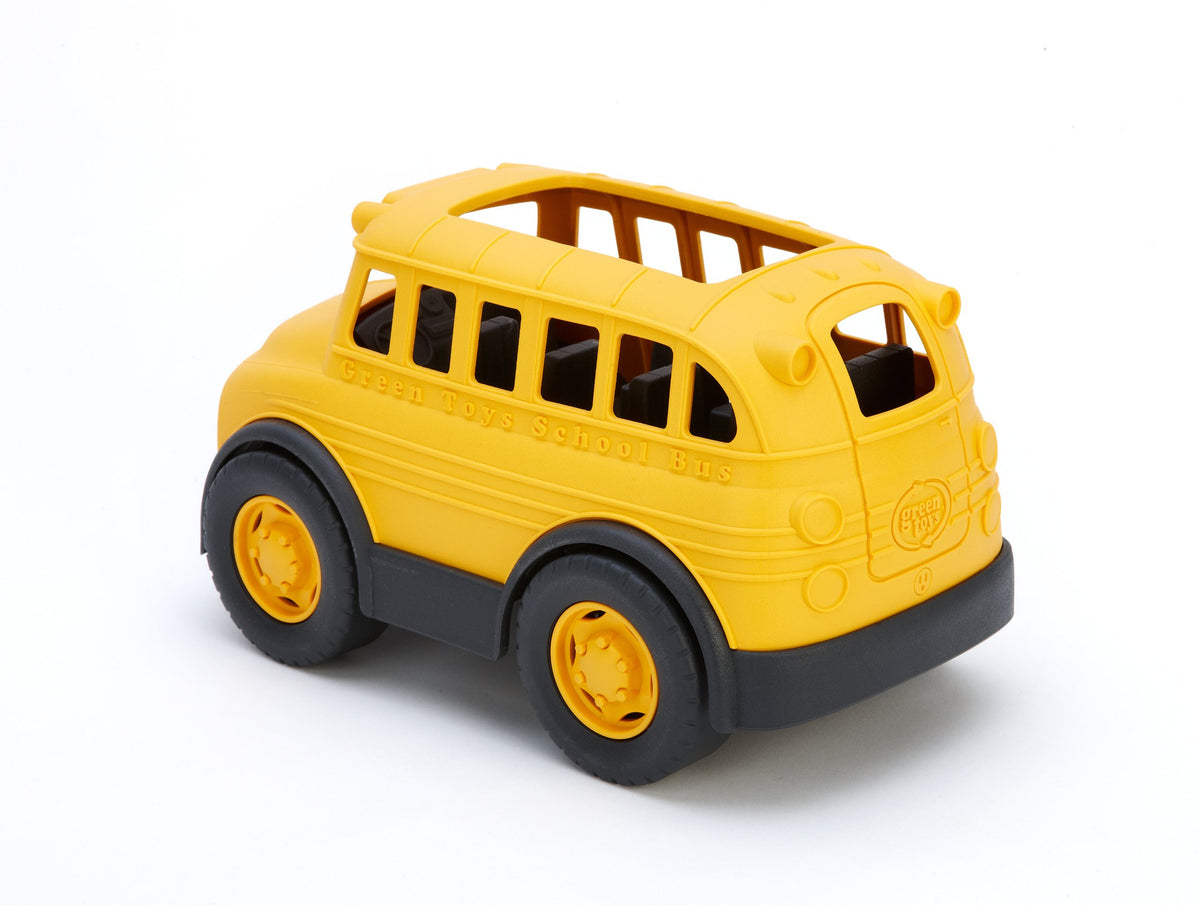 Green Toys School Bus Yellow loading passengers for group storytelling.