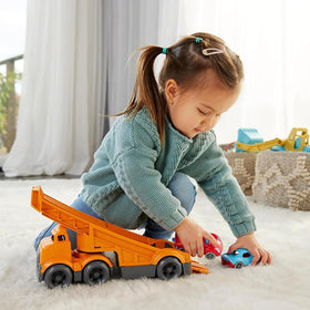 Green Toys two racers beside the truck for collaborative play.