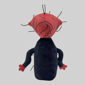 GRGJ The Boiled One plush in a bedroom decor setup.