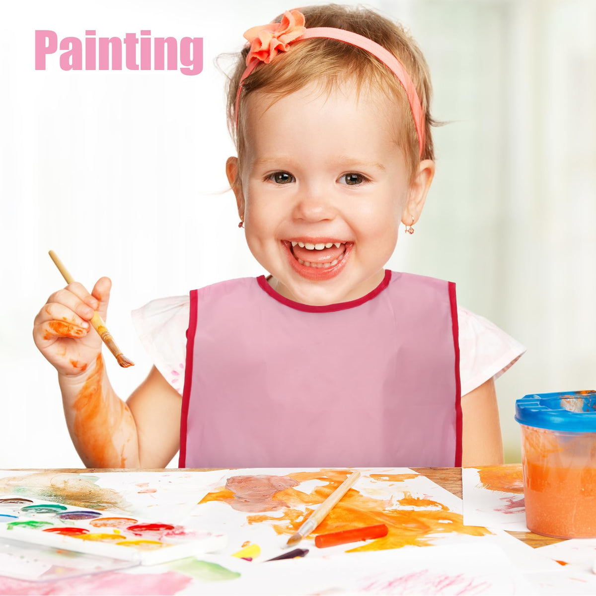 Guiqulai sleeveless art smock design allows freedom of movement while painting.