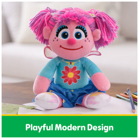Abby Cadabby pink plush body inviting soft hugs for toddlers.