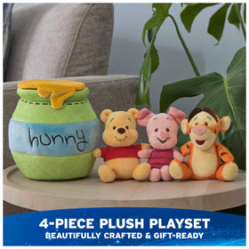 GUND Pooh 4in plush rattle adds gentle sound for sensory play.