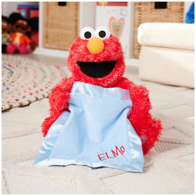 Elmo with blue satin blanket close-up showing soft texture
