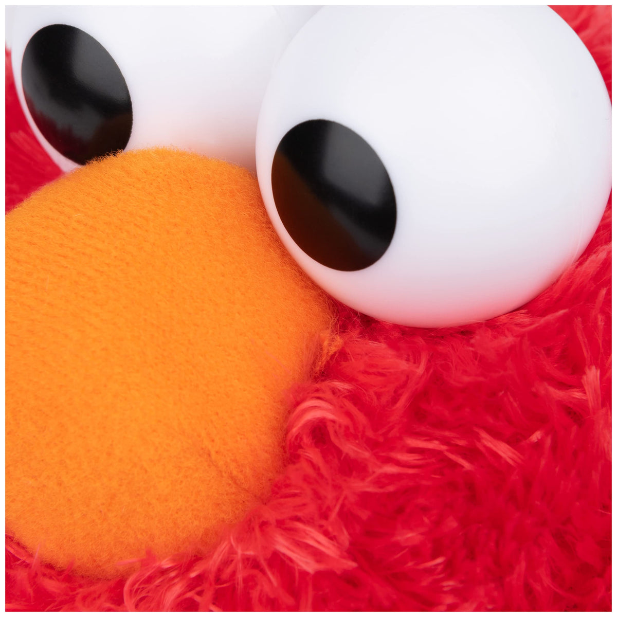 GUND Elmo plush smile emphasizes friendly, approachable charm for kids