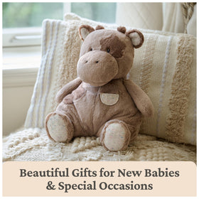 GUND Oh So Snuggly Cow plush shown in a nursery for modern décor.