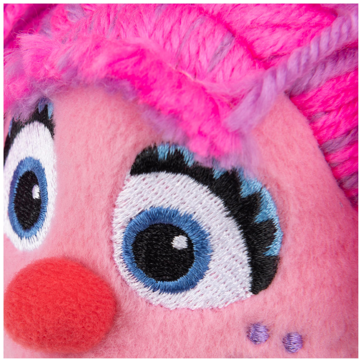 Yellow flower accessory held by Abby Cadabby adds cheerful scene.