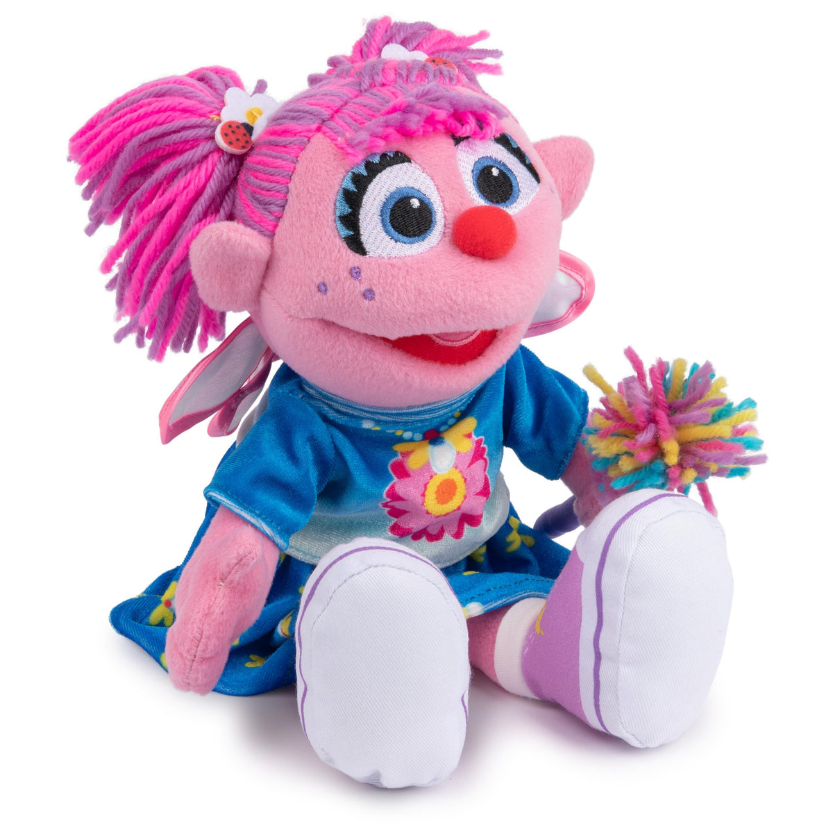 Bright pink and purple hair on Abby Cadabby encourages playful styling and storytelling.
