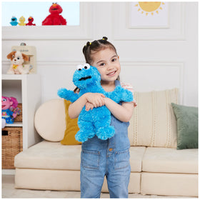 GUND Cookie Monster plush with outstretched arms invites hugs and adventures.