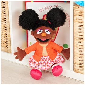 Gabrielle’s soft hair and afro-puffs invite gentle play and imaginative storytelling