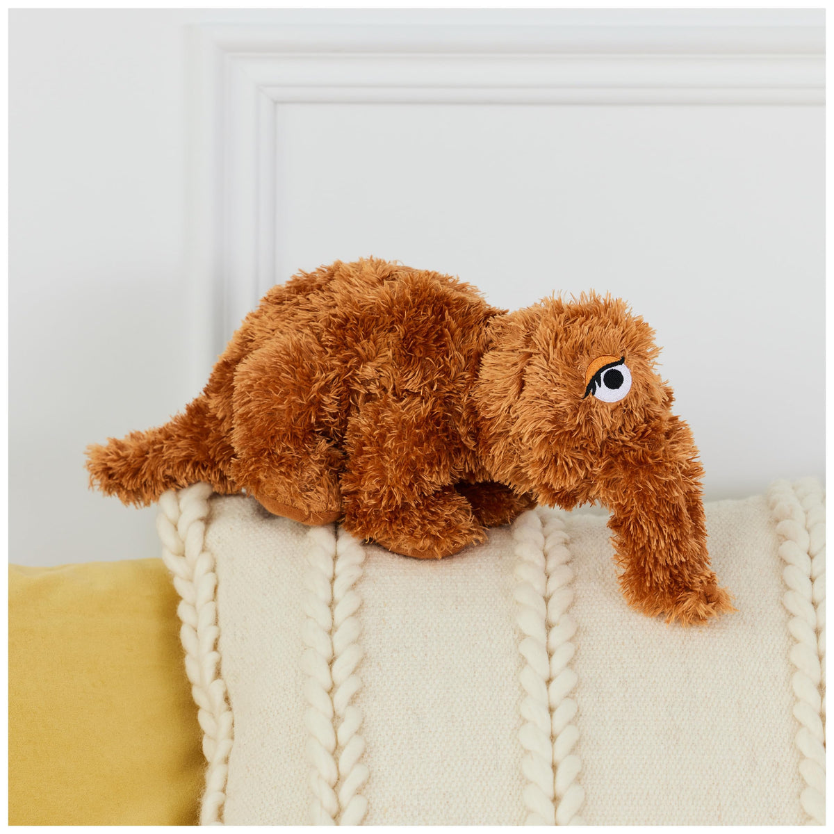 GUND Snuffleupagus plush close-up eyes emphasize gentle expression for comforting snuggles.