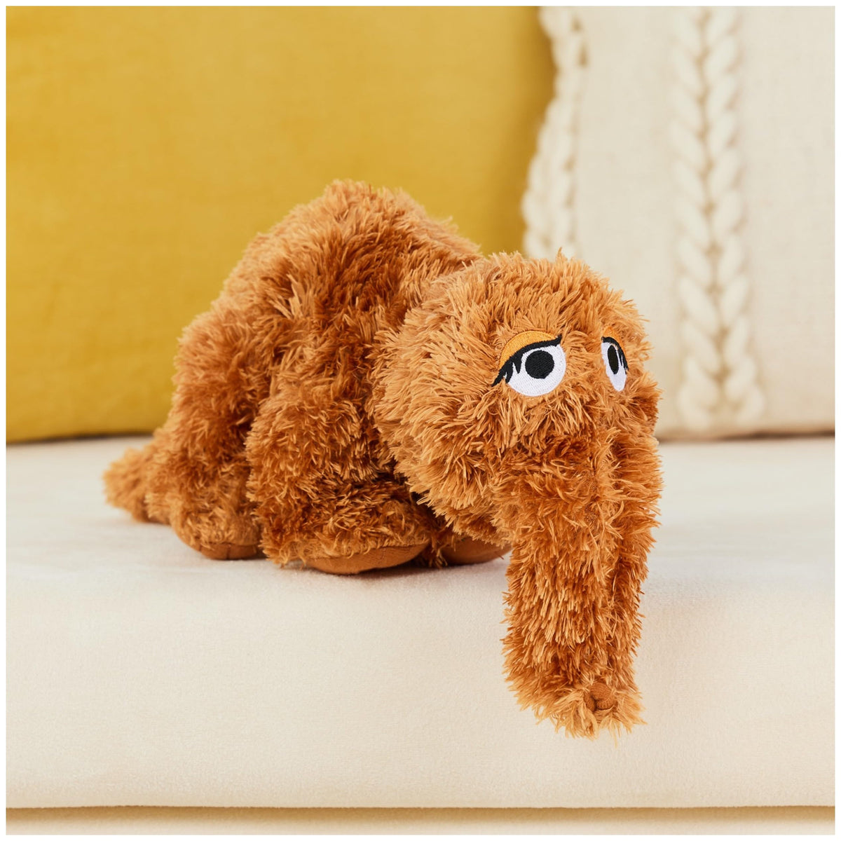 GUND Snuffleupagus 16-inch plush close-up face details with embroidered features for charm.