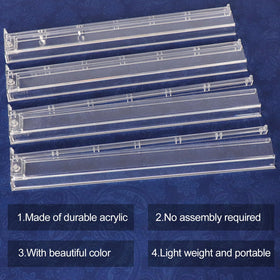 GUSTARIA set of 4 white rack-pushers keeps tiles organized.