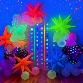 GYIPFIPA UV Neon Party Decor setup on wall and table for bold visuals