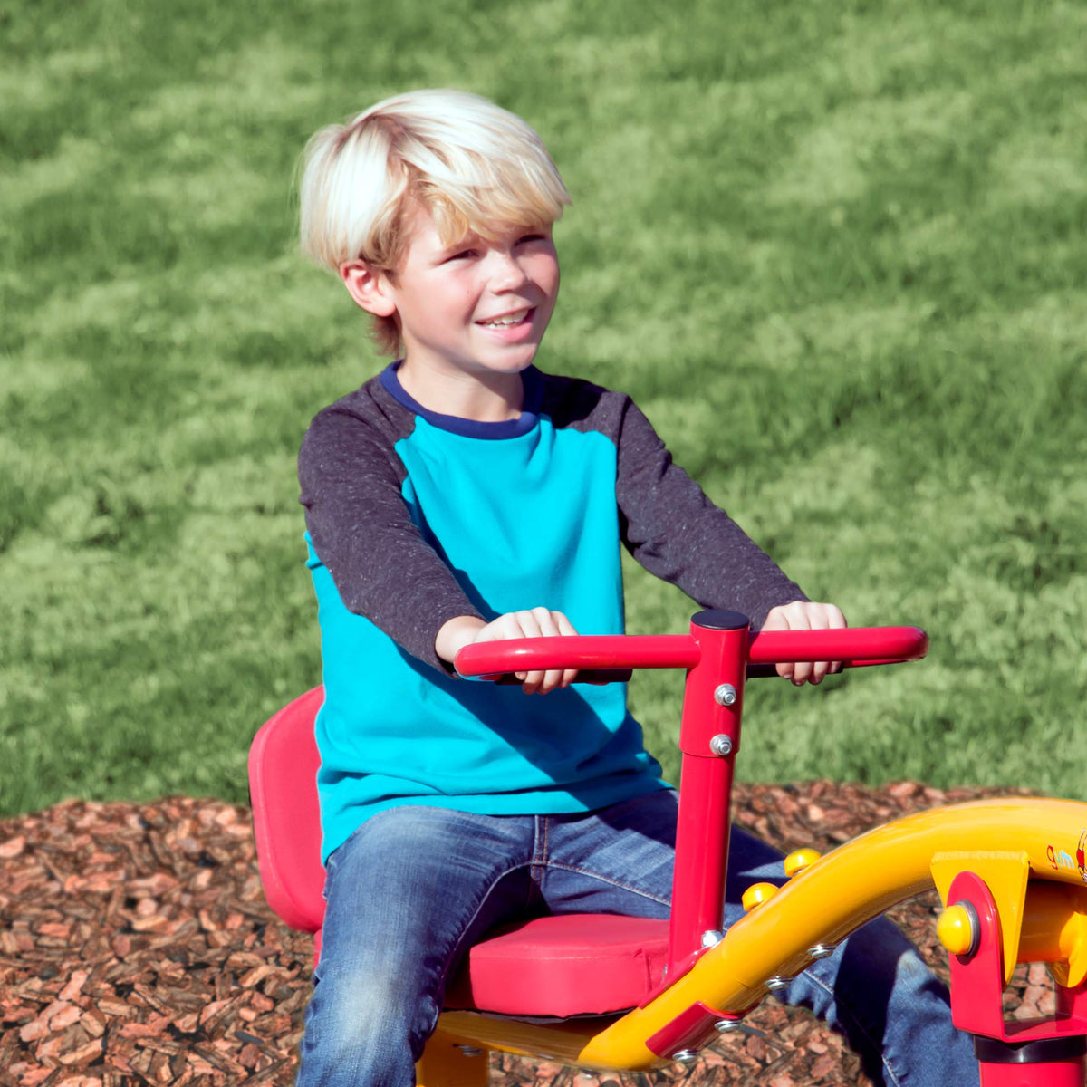 Seat cushions on Gym Dandy teeter totter for comfortable spins