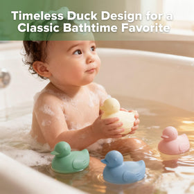 haakaa Dinky Splash Duck water spray feature promotes cause-and-effect play during baths.