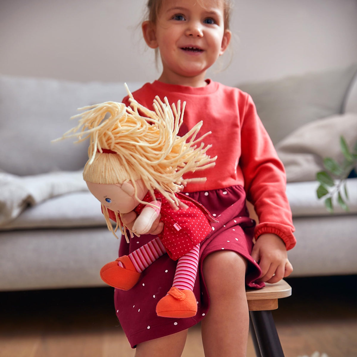 HABA Annelie removable red dress detail showing easy dressing feature