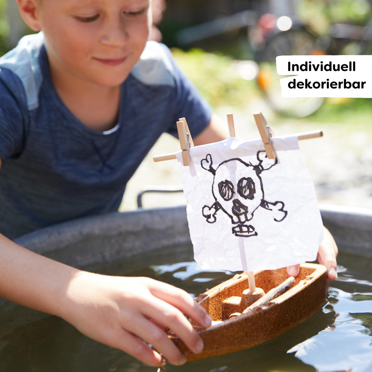 HABA DIY Cork Boat assembly scene with kid guiding simple building steps.