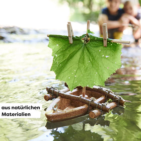HABA DIY Cork Boat sail attached for creative outdoor decorating with leaves and twigs.