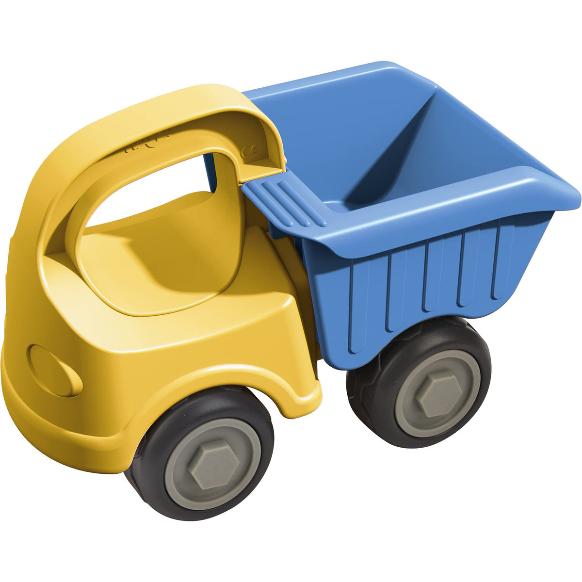 HABA dump truck beach toy on sand inviting imaginative sandbox play for toddlers.