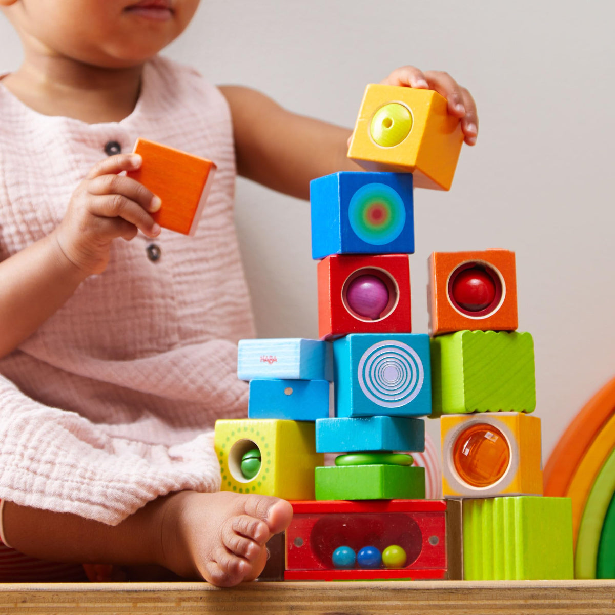 HABA discovery blocks in hand for audible sensory play
