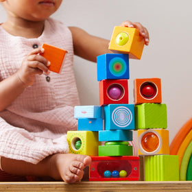 HABA discovery blocks in hand for audible sensory play