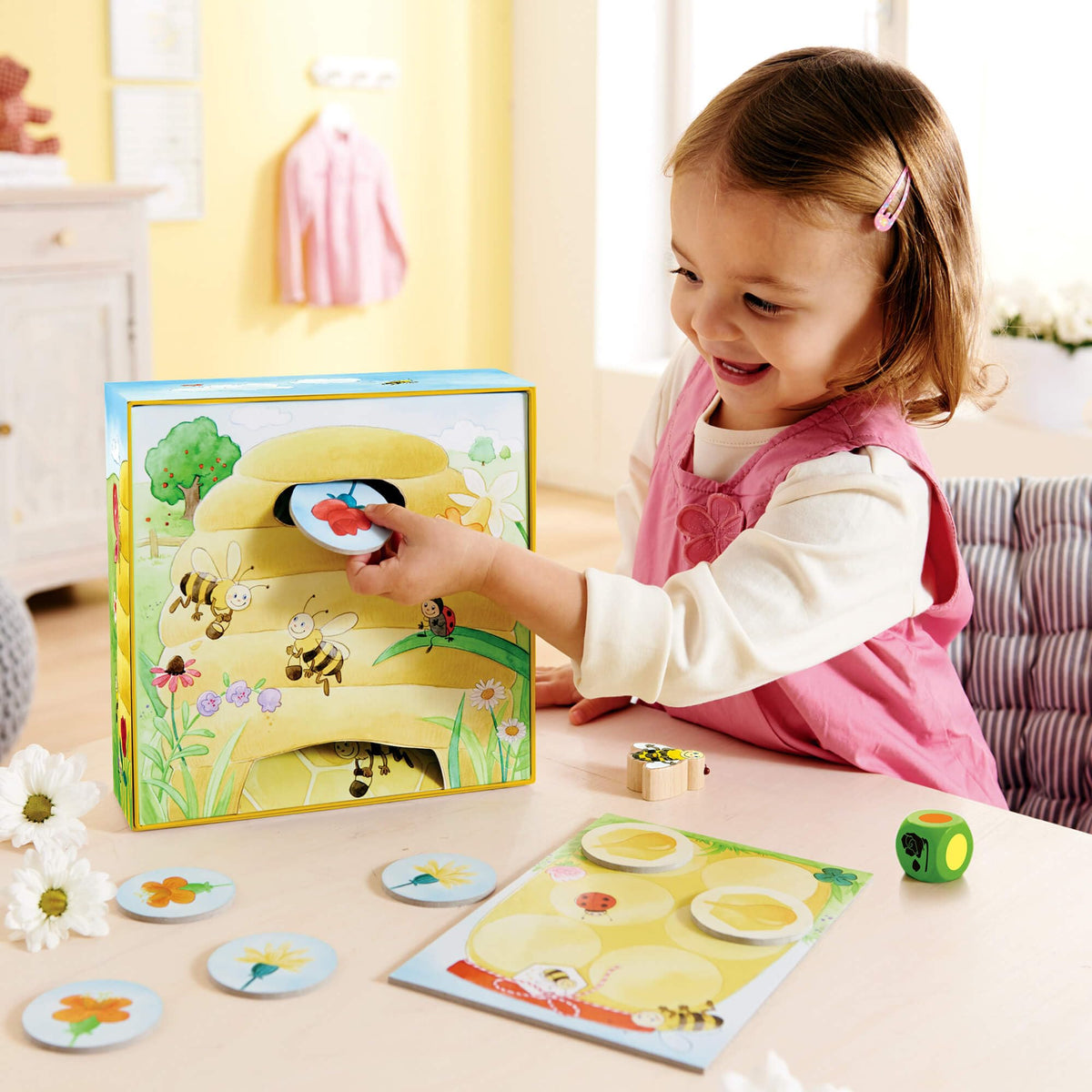 HABA Hanna Honeybee hive tile supports turn-taking through color matching.