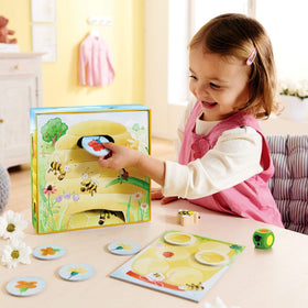 HABA Hanna Honeybee hive tile supports turn-taking through color matching.