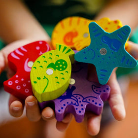 HABA Here Fishy Fishy puzzle pieces and game board for Solo or Multi play.