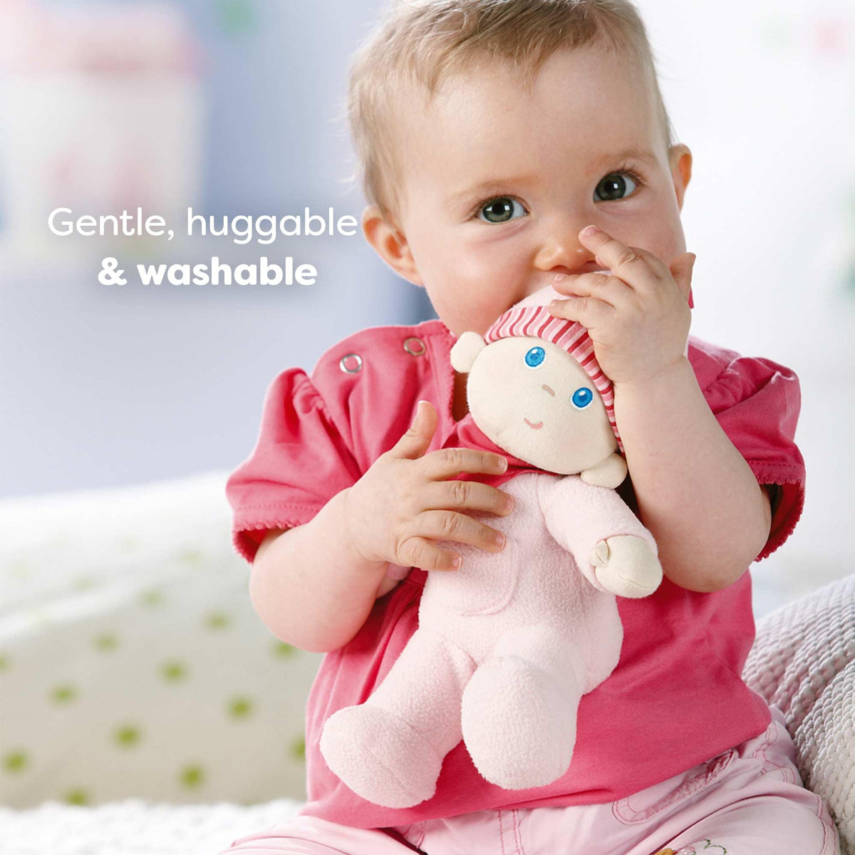 HABA Luisa Snug Up Doll features printed facial features for gentle play.