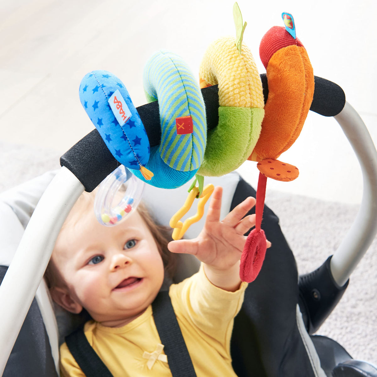 HABA Rainbow Spiral teether ring provides soothing relief during explorations