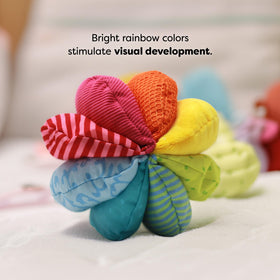 HABA Rainbow Baby Ball promotes grasping, rolling, and gross motor exploration.
