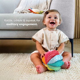 HABA Rainbow Baby Ball with crinkle panels for engaging sensory play.