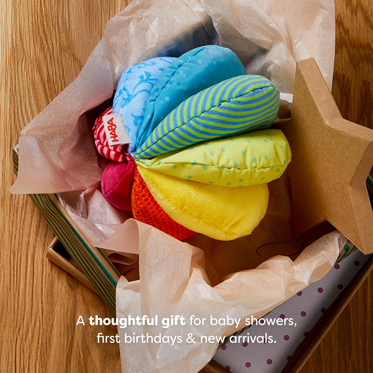 HABA Rainbow Baby Ball features soft materials for safe, cozy playtime.