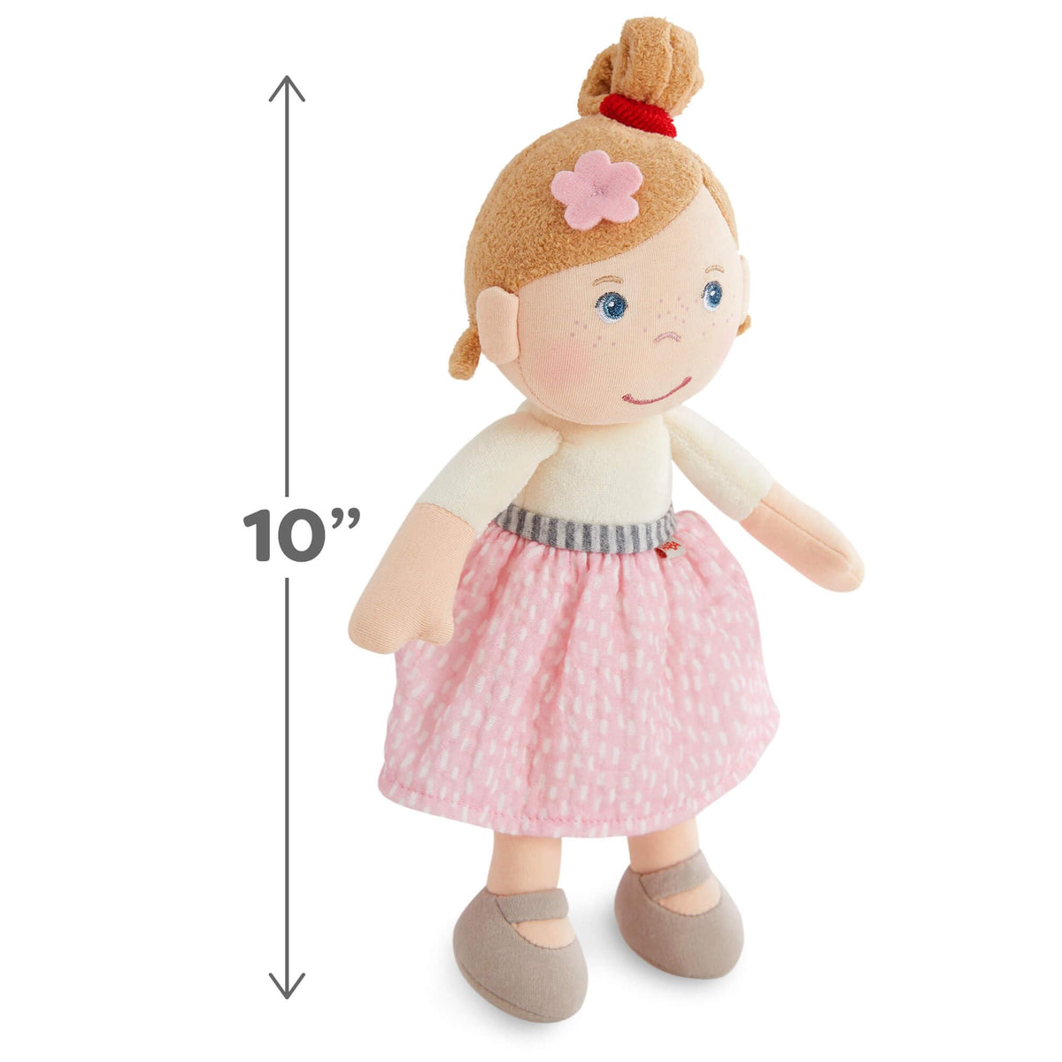 HABA Snug Up Lauren sandy blonde hair with a pink flower.