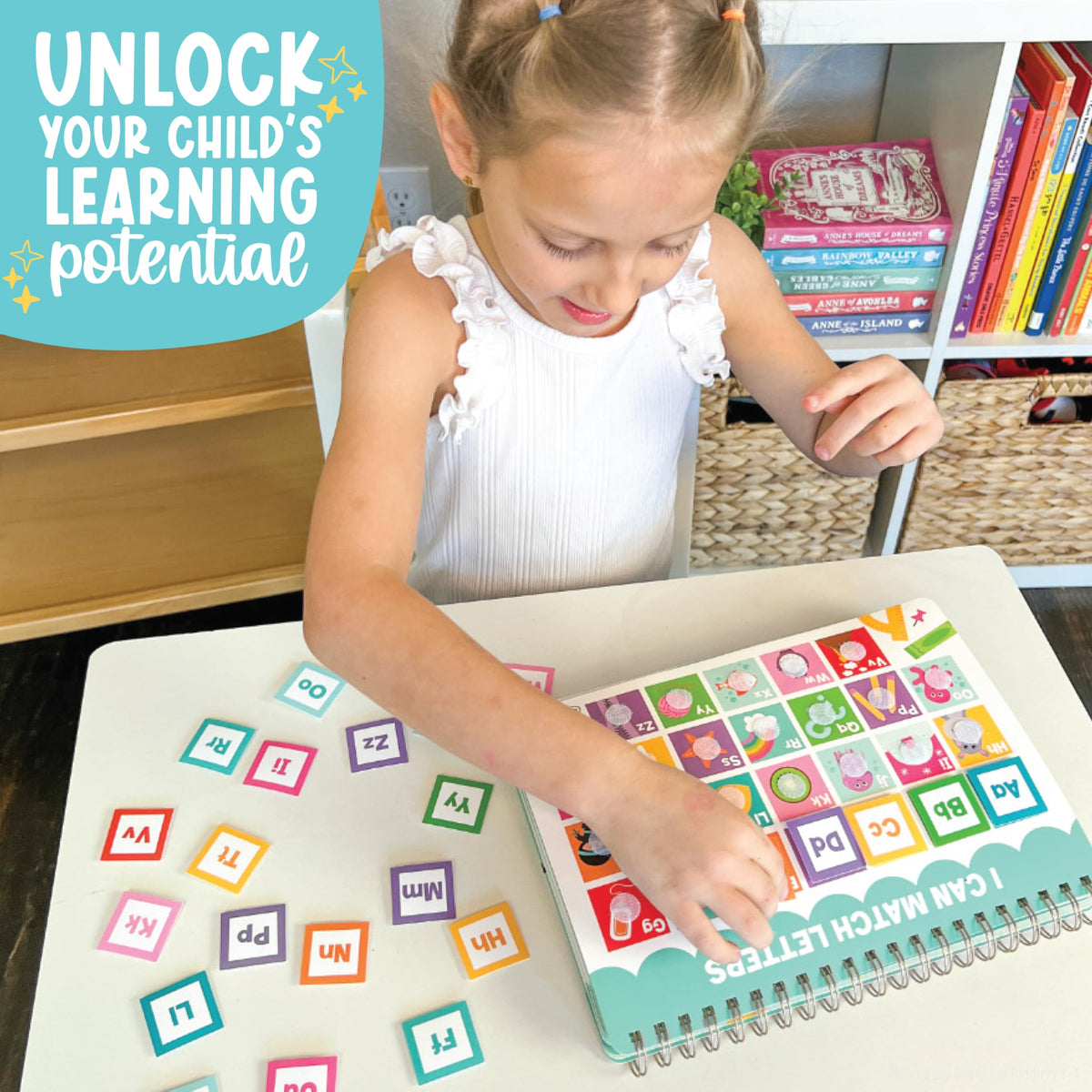 Hadley Designs travel scene image shows a kid-friendly busy book for car trips.