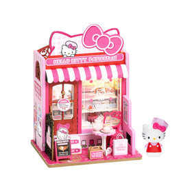 Hands Craft Hello Kitty patisserie assembly pieces for a satisfying DIY project.