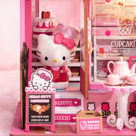 Hands Craft Hello Kitty patisserie macaron boxes highlight miniature treats.