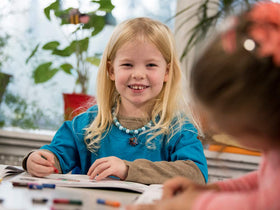 Handwriting Without Tears fine motor development through flipping action and color exploration.