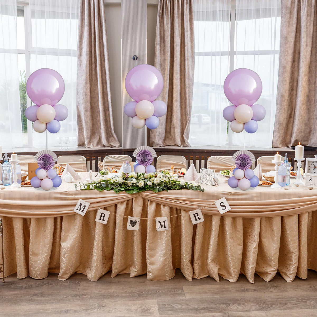 Hanna Roberts reusable stands; swap balloons for new themes.