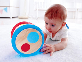Hape Baby Drum tapping colored circles to explore rhythm