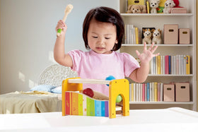 Hape balls dropping onto xylophone create pleasant tinkling tones.
